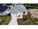 Single-story house with a driveway and nicely landscaped yard at 1138 Avenue E, Haines City, FL 33844