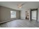 Bright bedroom with wood-look flooring and an ensuite bathroom at 1138 Avenue E, Haines City, FL 33844