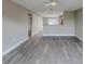 Open living space with hardwood floors and a view into the kitchen at 1138 Avenue E, Haines City, FL 33844