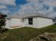 Newly constructed home with a white exterior and a two-car garage at 1138 Avenue E, Haines City, FL 33844