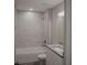 Updated bathroom with granite vanity and bathtub at 1138 Avenue E, Haines City, FL 33844