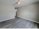 Simple bedroom with grey vinyl flooring and ceiling fan at 1138 Avenue E, Haines City, FL 33844