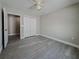Bedroom with ceiling fan, double doors and gray flooring at 1138 Avenue E, Haines City, FL 33844