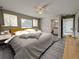 Main bedroom with ceiling fan and en-suite bathroom at 1138 Avenue E, Haines City, FL 33844