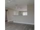 Open concept living room with grey flooring and a breakfast bar at 1138 Avenue E, Haines City, FL 33844