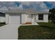 Newly constructed home with a white exterior and a two-car garage at 1138 Avenue E, Haines City, FL 33844