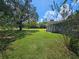 Spacious backyard with lush green grass and mature landscaping at 4810 N Galloway Rd, Lakeland, FL 33810