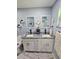 Modern bathroom with dual vanities, white cabinets, granite countertop, and decorative accents at 4810 N Galloway Rd, Lakeland, FL 33810