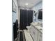 Updated bathroom featuring a walk-in shower, vanity, and contemporary finishes at 4810 N Galloway Rd, Lakeland, FL 33810