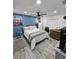 Bedroom with ceiling fan, queen bed, and blue accent wall at 4810 N Galloway Rd, Lakeland, FL 33810