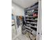 Organized closet with shelves for shoes, bags, and hanging clothes at 4810 N Galloway Rd, Lakeland, FL 33810