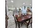 Dining area with a view of the updated kitchen featuring white cabinets and dark countertops at 4810 N Galloway Rd, Lakeland, FL 33810