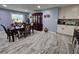 Dining area adjacent to the kitchen, showcasing white cabinetry and marble-look tile at 4810 N Galloway Rd, Lakeland, FL 33810