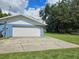 Concrete driveway leading to an attached garage at 4810 N Galloway Rd, Lakeland, FL 33810