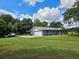 Exterior view of a blue ranch-style home with a two-car garage at 4810 N Galloway Rd, Lakeland, FL 33810