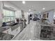 Open concept kitchen with stainless steel appliances, island, and view of the living area at 4810 N Galloway Rd, Lakeland, FL 33810