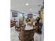 Elegant living room with ornate furniture, marble-look tile, and soft blue walls at 4810 N Galloway Rd, Lakeland, FL 33810