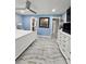 Main bedroom with white bed, dresser, ceiling fan, walk-in closet, and ensuite bathroom access at 4810 N Galloway Rd, Lakeland, FL 33810