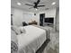 Spacious main bedroom with a king-size bed, ceiling fan, and walk-in closet at 4810 N Galloway Rd, Lakeland, FL 33810