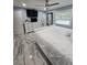 Large main bedroom with white furnishings, ceiling fan, and marble-look tile floors at 4810 N Galloway Rd, Lakeland, FL 33810