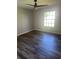 Bright bedroom with hardwood floors and ceiling fan at 561 Old Geneva Rd, Geneva, FL 32732