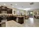 Open concept kitchen with granite countertops and stainless steel appliances at 9151 Wedge Dr, Davenport, FL 33896