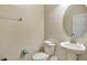 Clean and simple half bathroom with a pedestal sink and toilet at 9151 Wedge Dr, Davenport, FL 33896