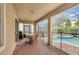 Enclosed patio area with a pool and spa, and outdoor dining at 9151 Wedge Dr, Davenport, FL 33896
