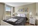 Well-lit bedroom with a plush double bed and window at 9151 Wedge Dr, Davenport, FL 33896