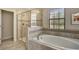 Spa-like bathroom with walk-in shower and soaking tub at 9151 Wedge Dr, Davenport, FL 33896