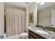 Clean bathroom with tub shower combo and granite vanity at 9151 Wedge Dr, Davenport, FL 33896