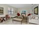 Cozy living room featuring a comfortable sofa and a large flat-screen TV at 9151 Wedge Dr, Davenport, FL 33896