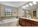 Large bathroom with soaking tub and double vanity at 9151 Wedge Dr, Davenport, FL 33896