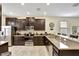 Modern kitchen featuring stainless steel appliances and dark wood cabinetry at 9151 Wedge Dr, Davenport, FL 33896
