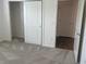 Bedroom with carpet, closet, and additional door at 4415 Casey Ct, The Villages, FL 32163