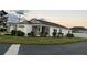 Single-story house with attached garage and screened porch at 4415 Casey Ct, The Villages, FL 32163