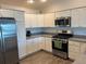 Well-equipped kitchen boasting stainless steel appliances and ample cabinetry at 4415 Casey Ct, The Villages, FL 32163