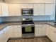 Clean lines and stainless steel appliances in this updated kitchen at 4415 Casey Ct, The Villages, FL 32163