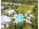 Aerial view of a community pool with a clubhouse and palm trees at 1455 Viscaya Cove Blvd, Winter Garden, FL 34787