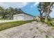 Side view of the house showcasing two-car garage at 225 Diesel Rd, Mulberry, FL 33860