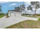 Two-car garage with white walls and black accents at 225 Diesel Rd, Mulberry, FL 33860