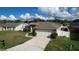 Single-Gathering home with driveway and a backyard at 5836 Daughtery Downs Loop, Lakeland, FL 33809