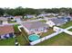 Aerial view of a house with a fenced backyard and above-ground pool at 5836 Daughtery Downs Loop, Lakeland, FL 33809