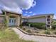 House exterior showcasing teal front door and landscaping at 5836 Daughtery Downs Loop, Lakeland, FL 33809