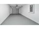 One car garage with painted floor and garage door opener at 15499 Sw 27Th Ln, Ocala, FL 34481