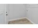 Laundry closet with vinyl plank flooring and built-in shelving at 15499 Sw 27Th Ln, Ocala, FL 34481