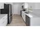 Clean kitchen featuring white shaker cabinets and quartz countertops at 15499 Sw 27Th Ln, Ocala, FL 34481