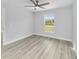 Spacious bedroom with vinyl plank flooring and large window at 15499 Sw 27Th Ln, Ocala, FL 34481