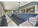 Screened porch with gray walls, open view, and hanging light at 3220 Crooked Oak Ct, Orlando, FL 32808