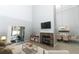 Living room with fireplace, high ceilings, and access to patio at 7126 Regina Way, Orlando, FL 32819